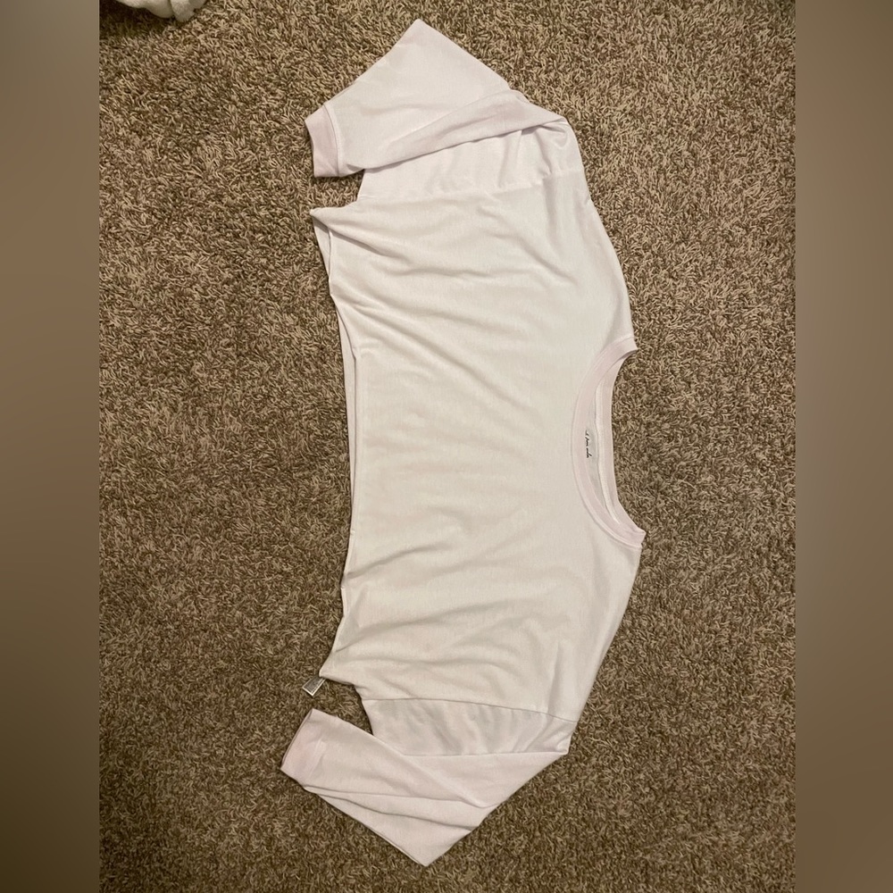 Cropped, white, long sleeved top from Urban Outfitters.